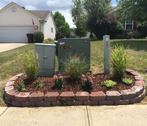 cable and electric box in backyard|hiding utility boxes around house.